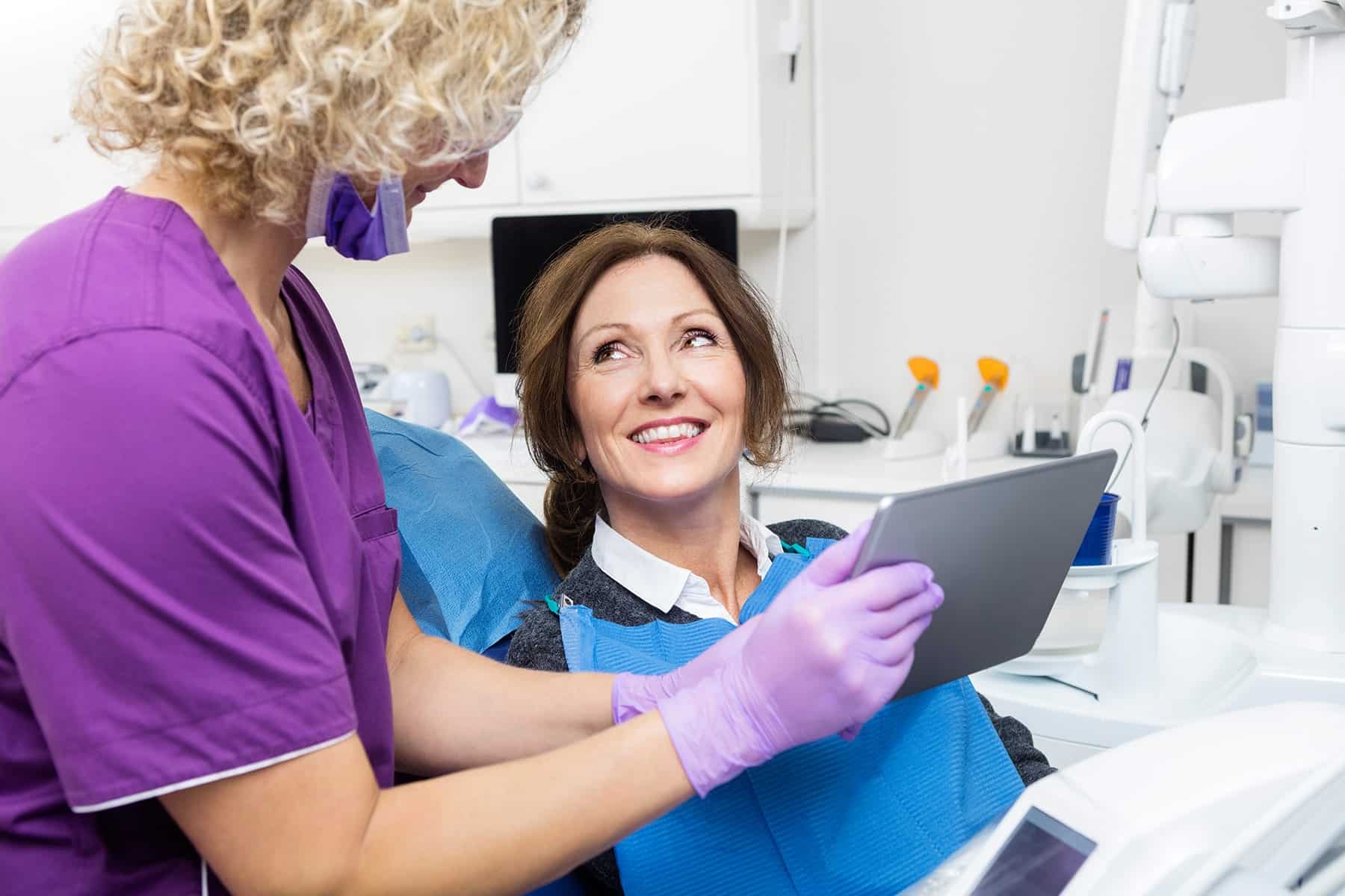 Woman visiting the restorative dentist in Cumming, GA