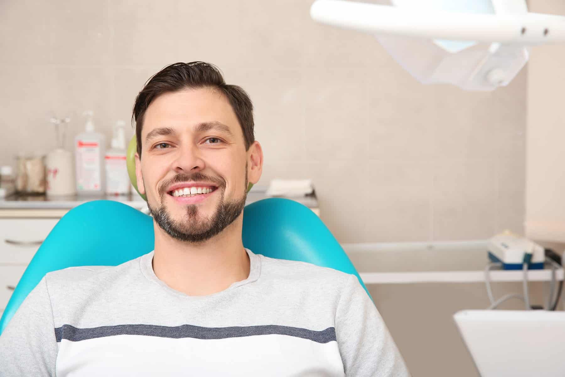 Man smiling with dental crowns in Cumming, GA