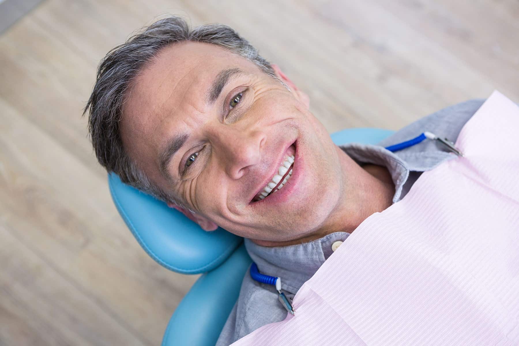 Man smiling at the dental crown dentist in Cumming, GA